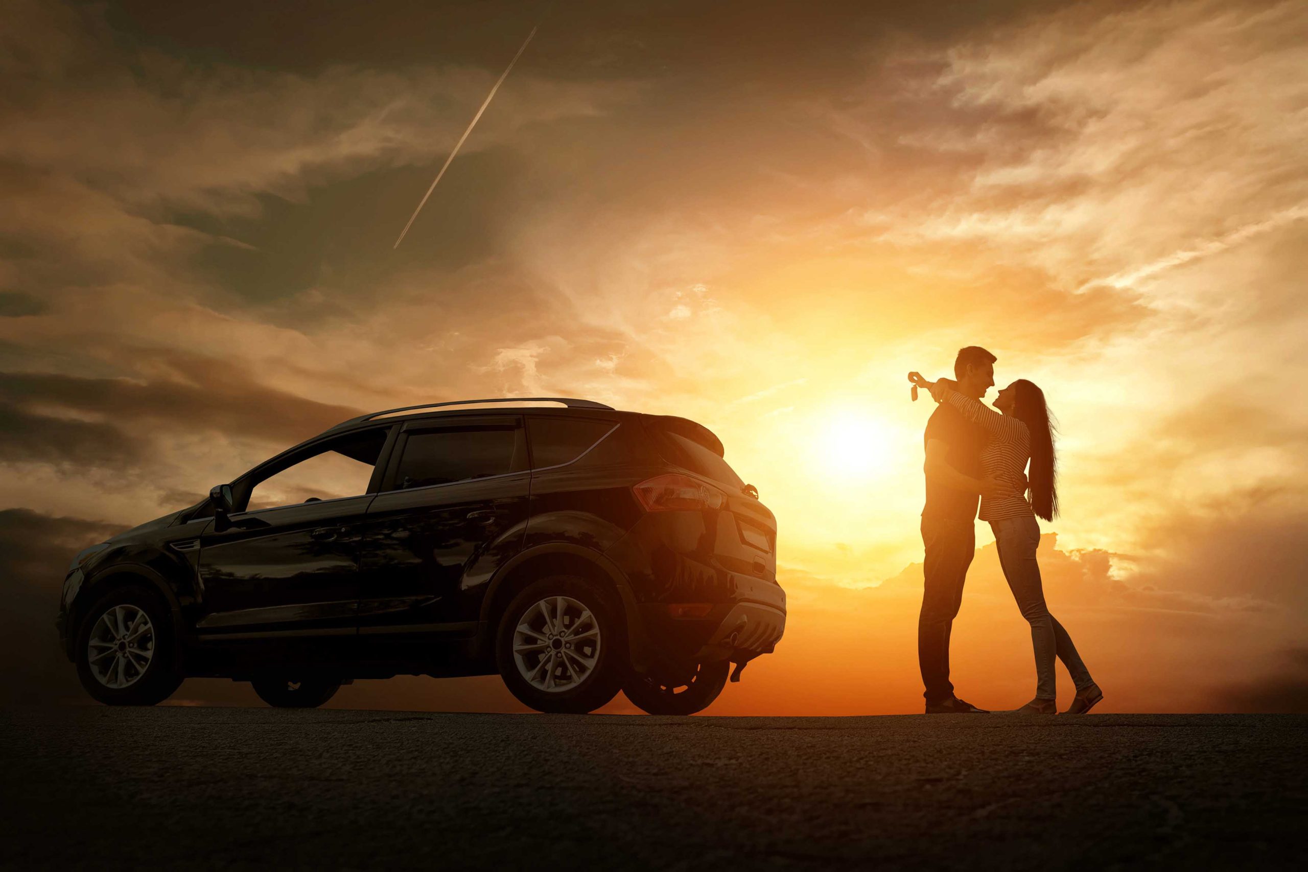 Silhouette of happiness couple stay near the new car under sky